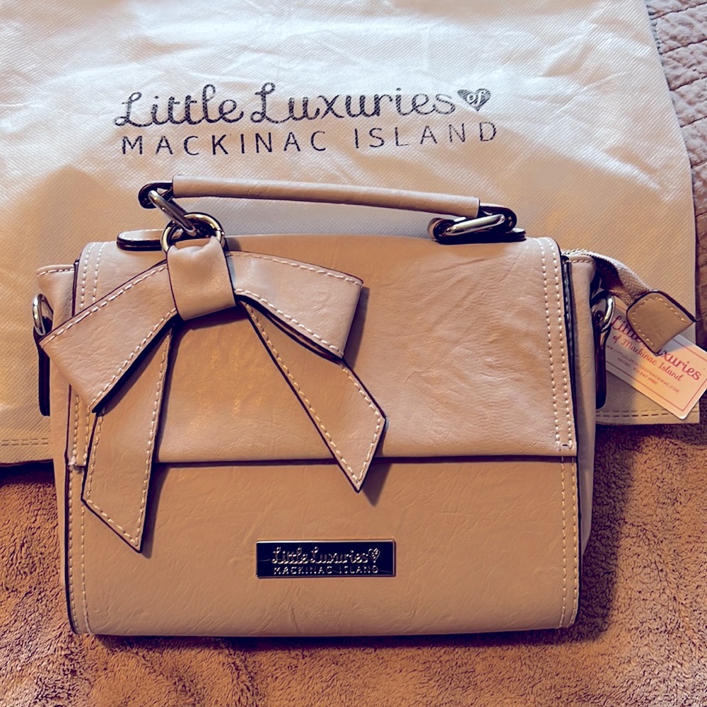Little Luxuries small grey vegan leather handbag with shoulder strap.